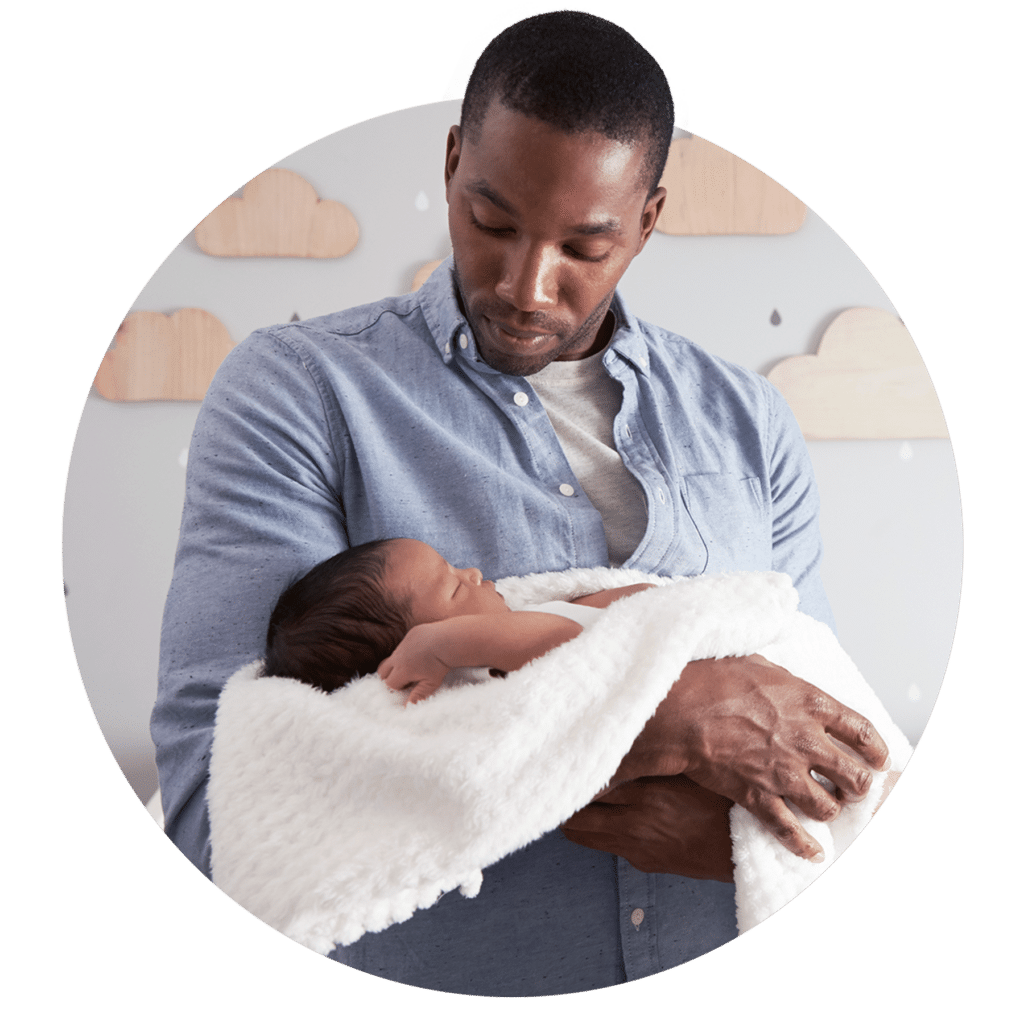 Man holding a newborn infant.